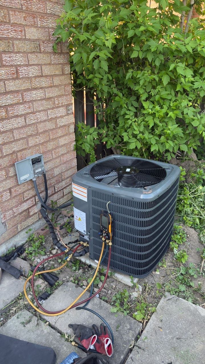 Central air conditioner condenser installation exterior Toronto home