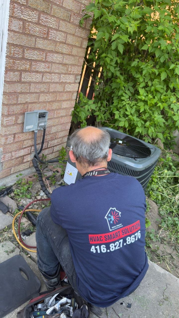 HVAC Smart Solution technician servicing air conditioner condenser Toronto